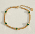 Pulsera dorada con circón verde