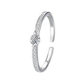 Anillo abierto con circón central, plata de ley 925