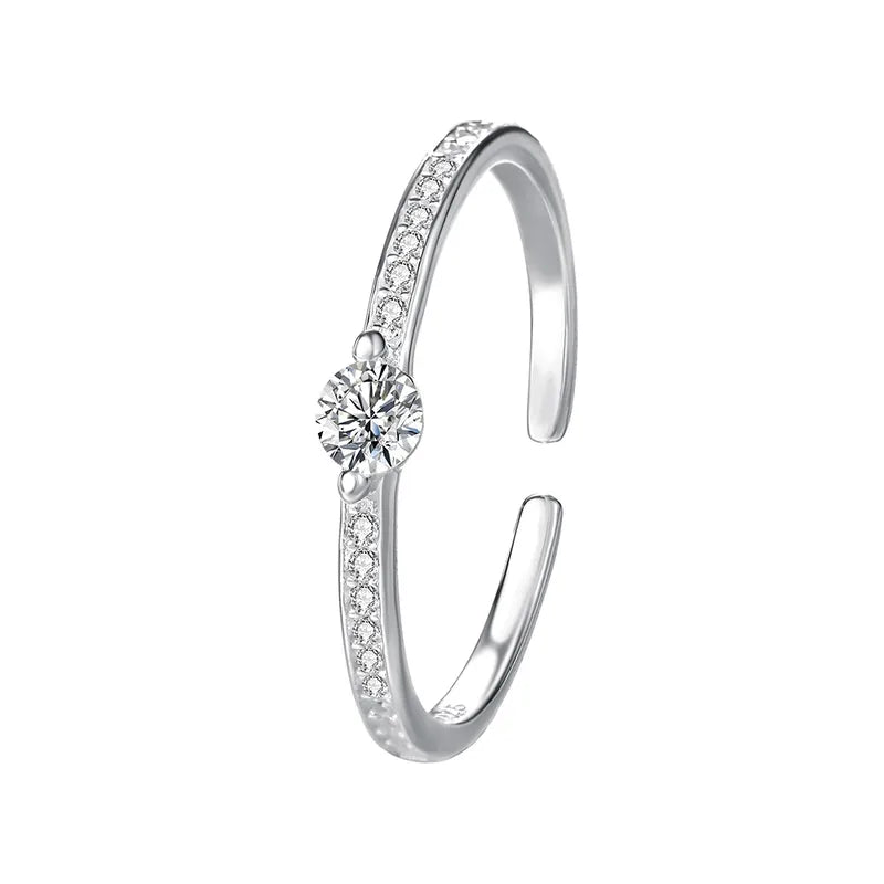 Anillo abierto con circón central, plata de ley 925