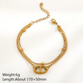 Pulsera doble cadena con eslabón central, acero 304 con baño de oro 18k